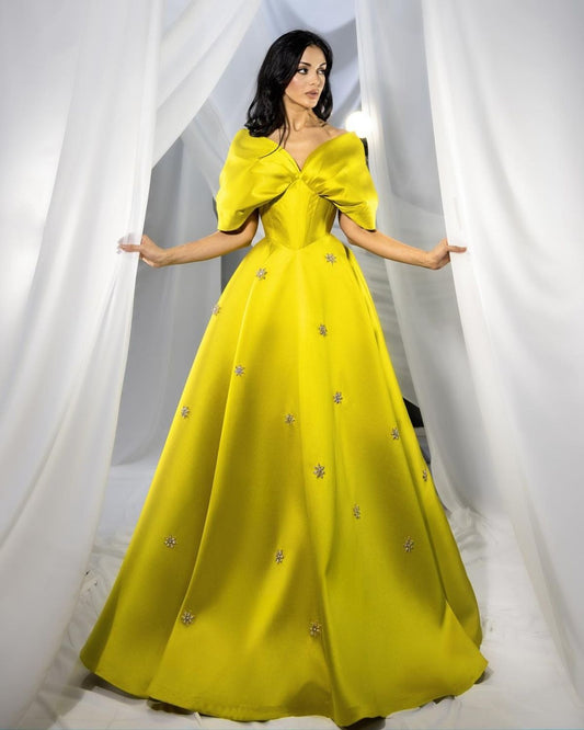 Bright yellow embroidered Ballgown with shoulder pleats