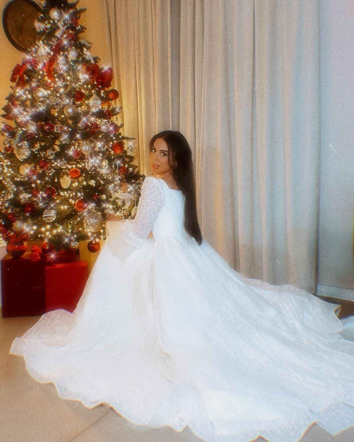 Rula Alazawi in White embroidered ball gown