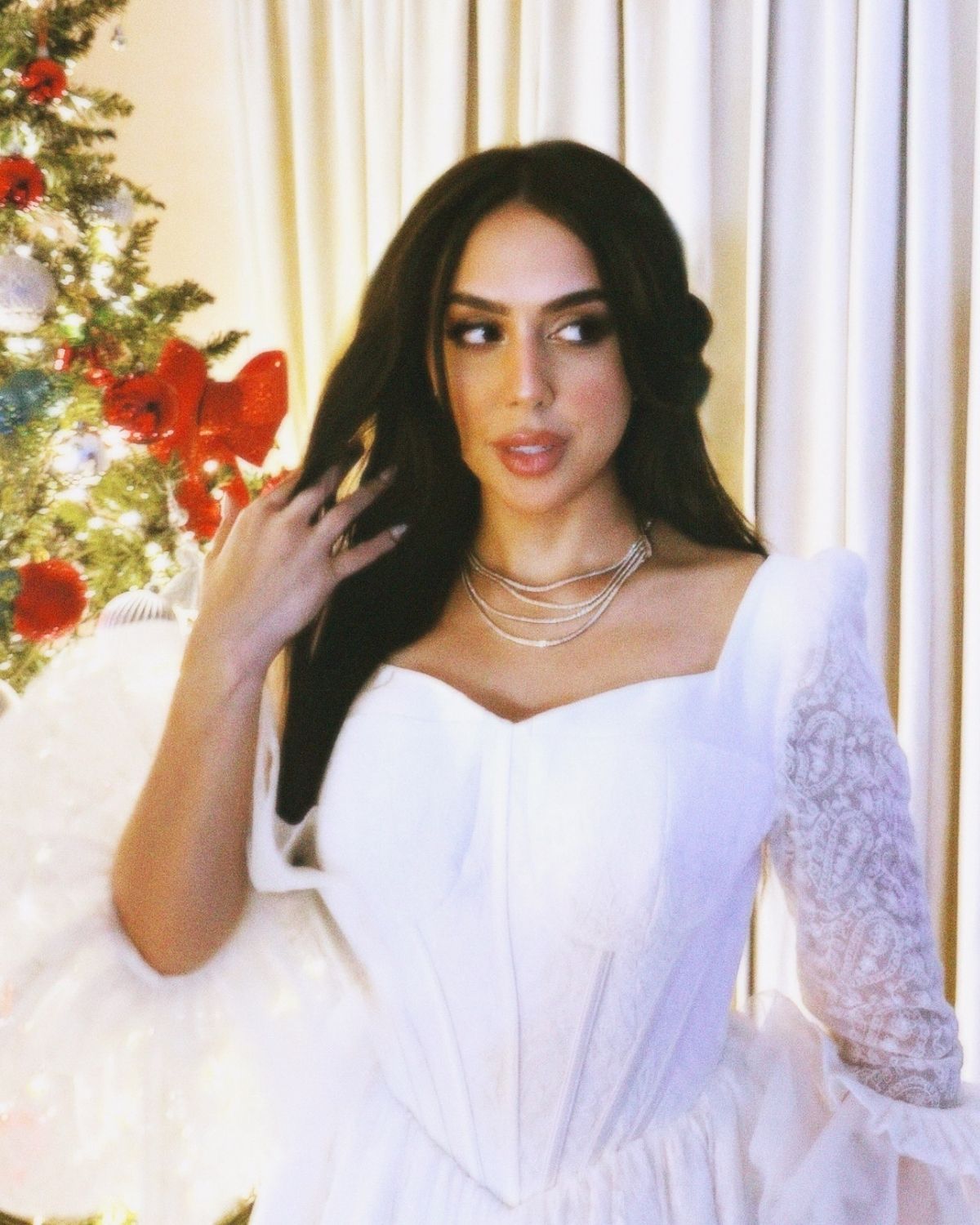 Rula Alazawi in White embroidered ball gown