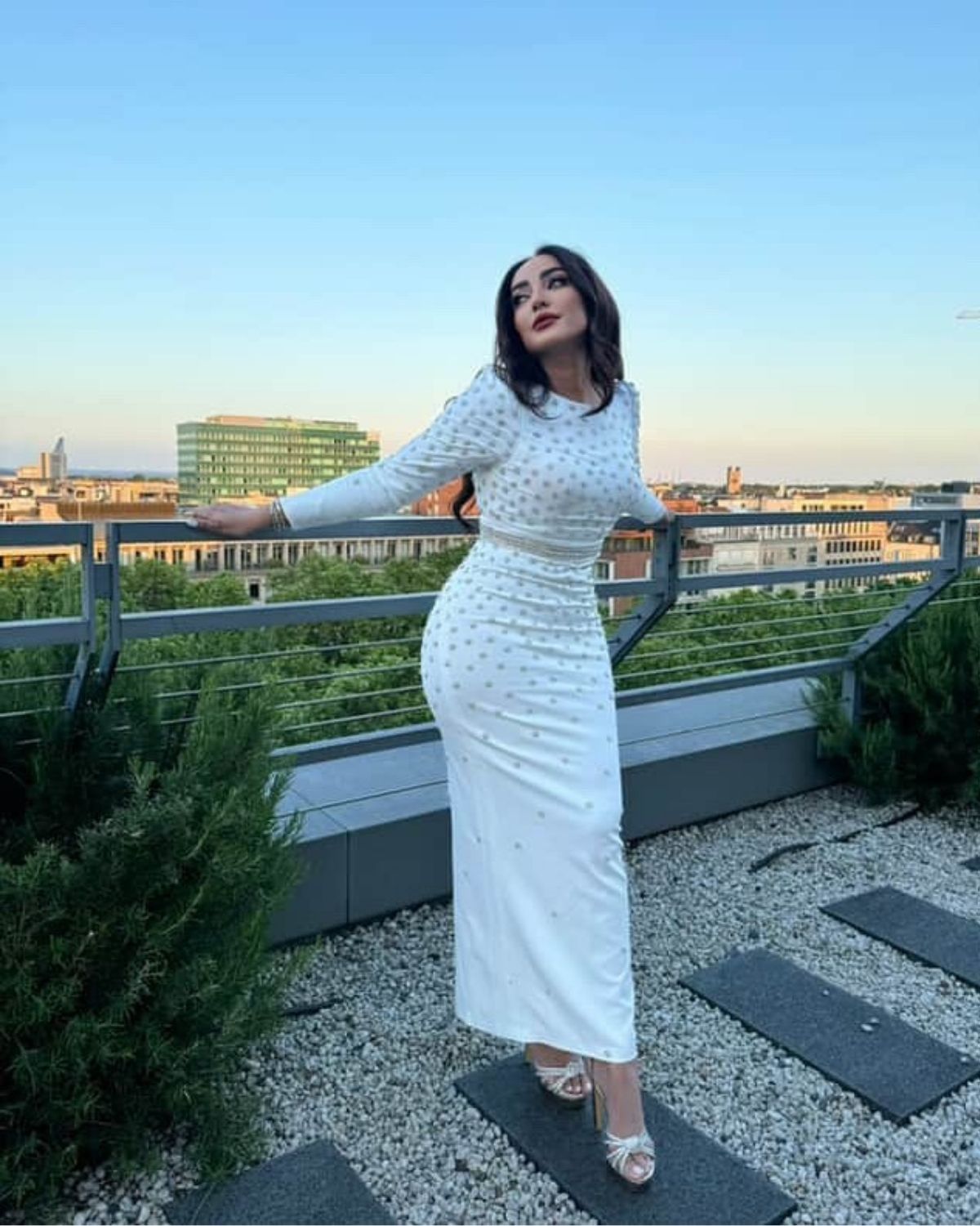 Jamila Elbadaoui in white crystal bodycon dress