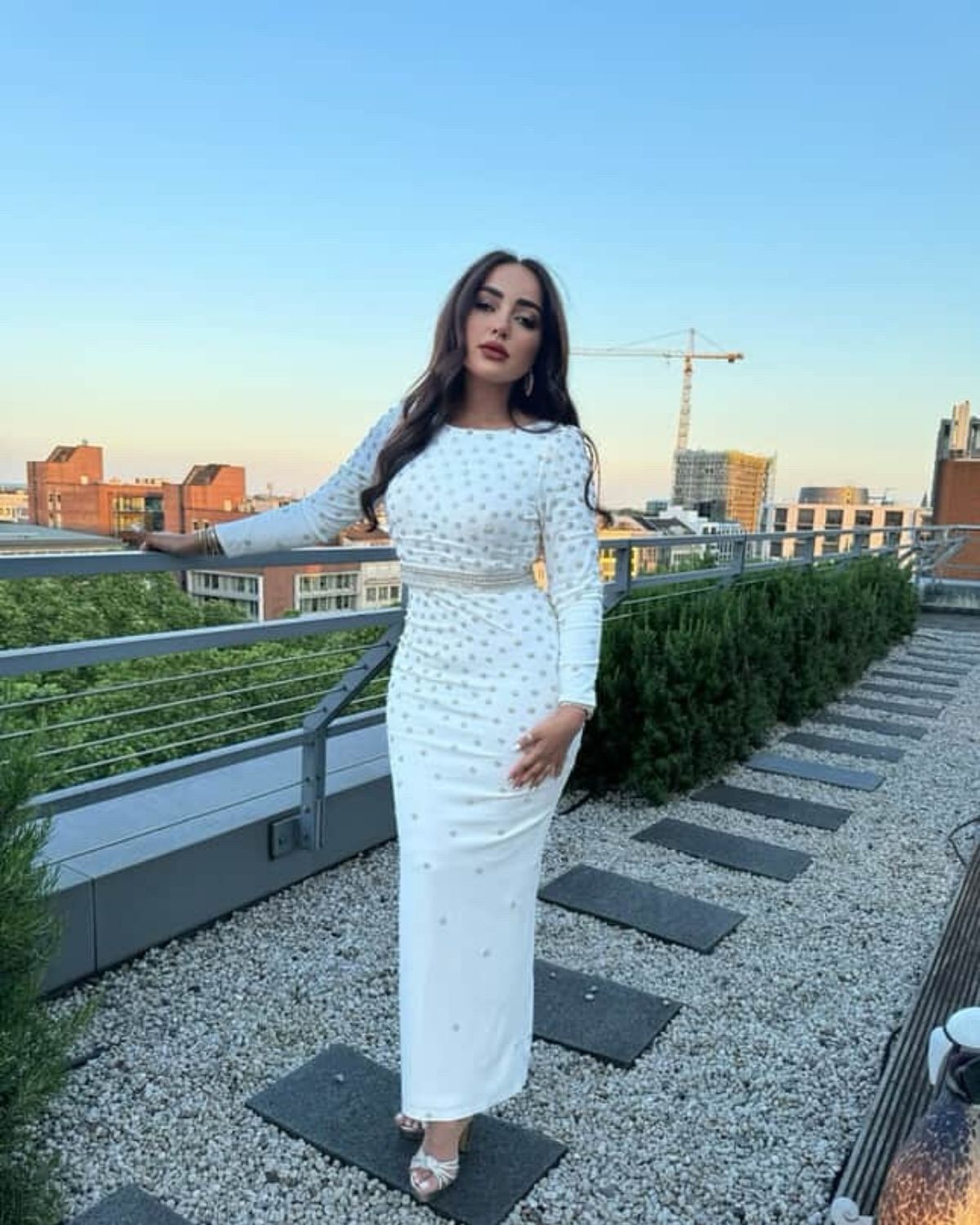 Jamila Elbadaoui in white crystal bodycon dress