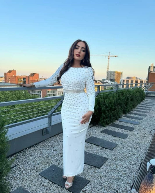 Jamila Elbadaoui in white crystal bodycon dress