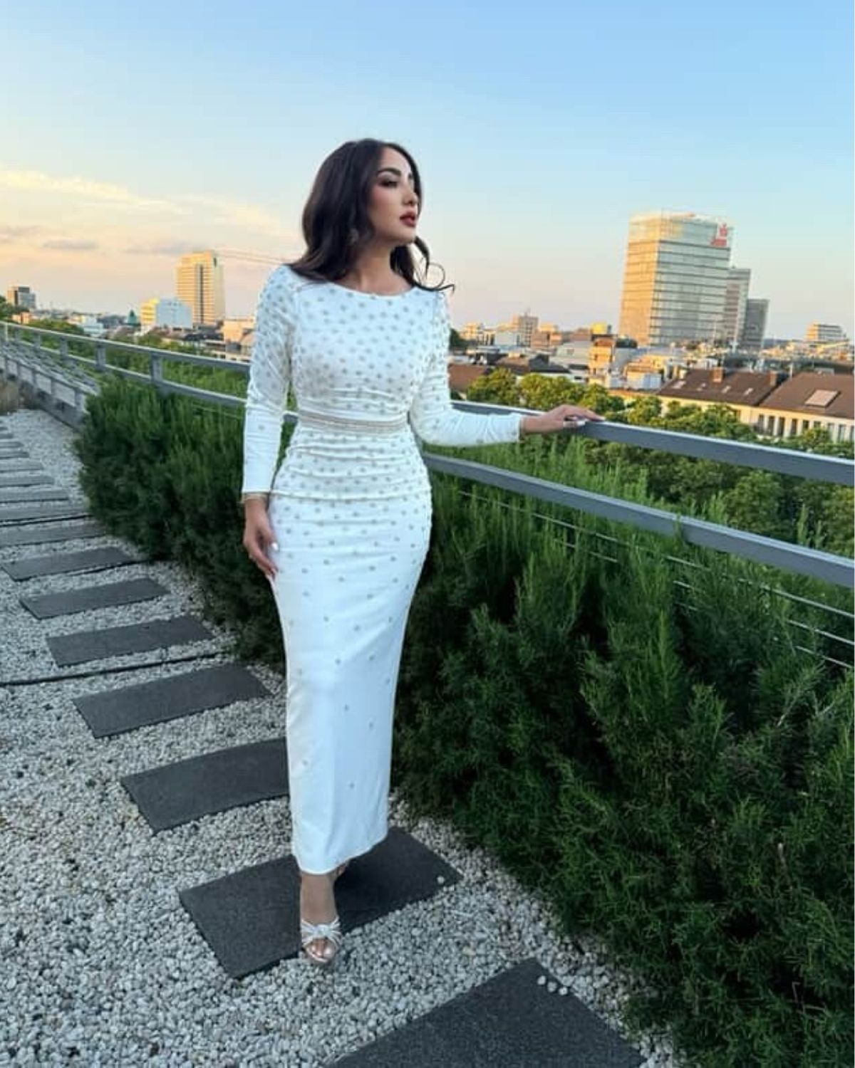 Jamila Elbadaoui in white crystal bodycon dress