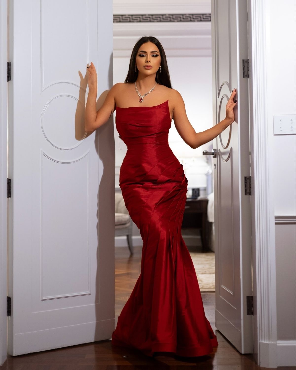 Rania Mazbouh in Custom red bodycon gown