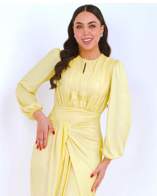 Rula Alazawi in yellow drape gown