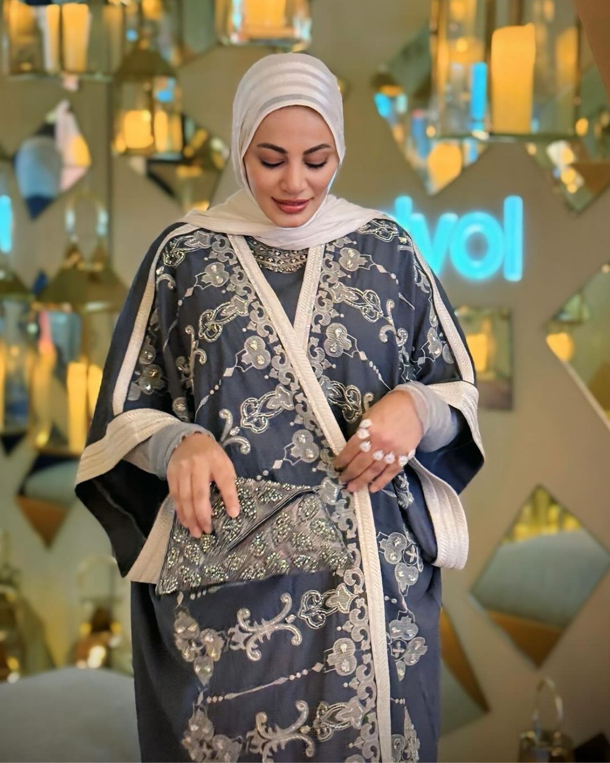 Raniaa Yehia in grey Abaya set